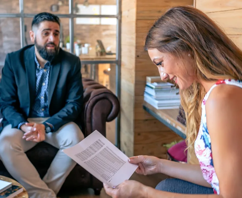 Illustrative business discussion around a table